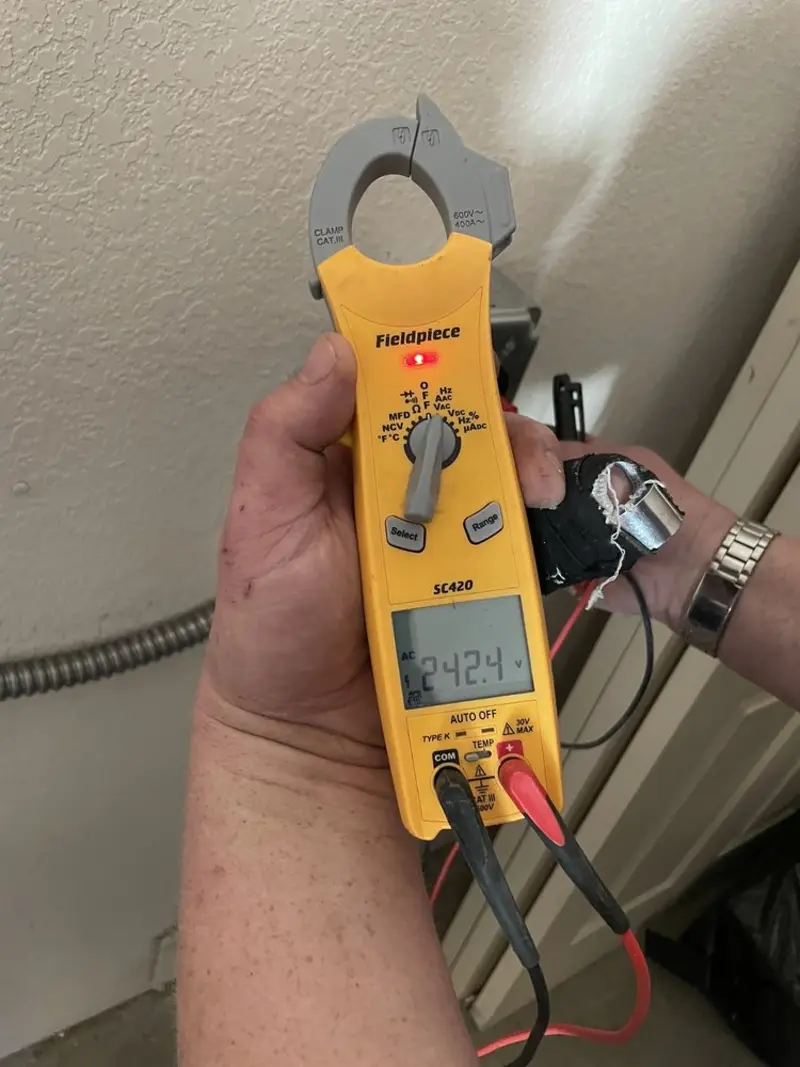 Voltage testing with clamp meter during Ceiling Fan Installation in Little Britain